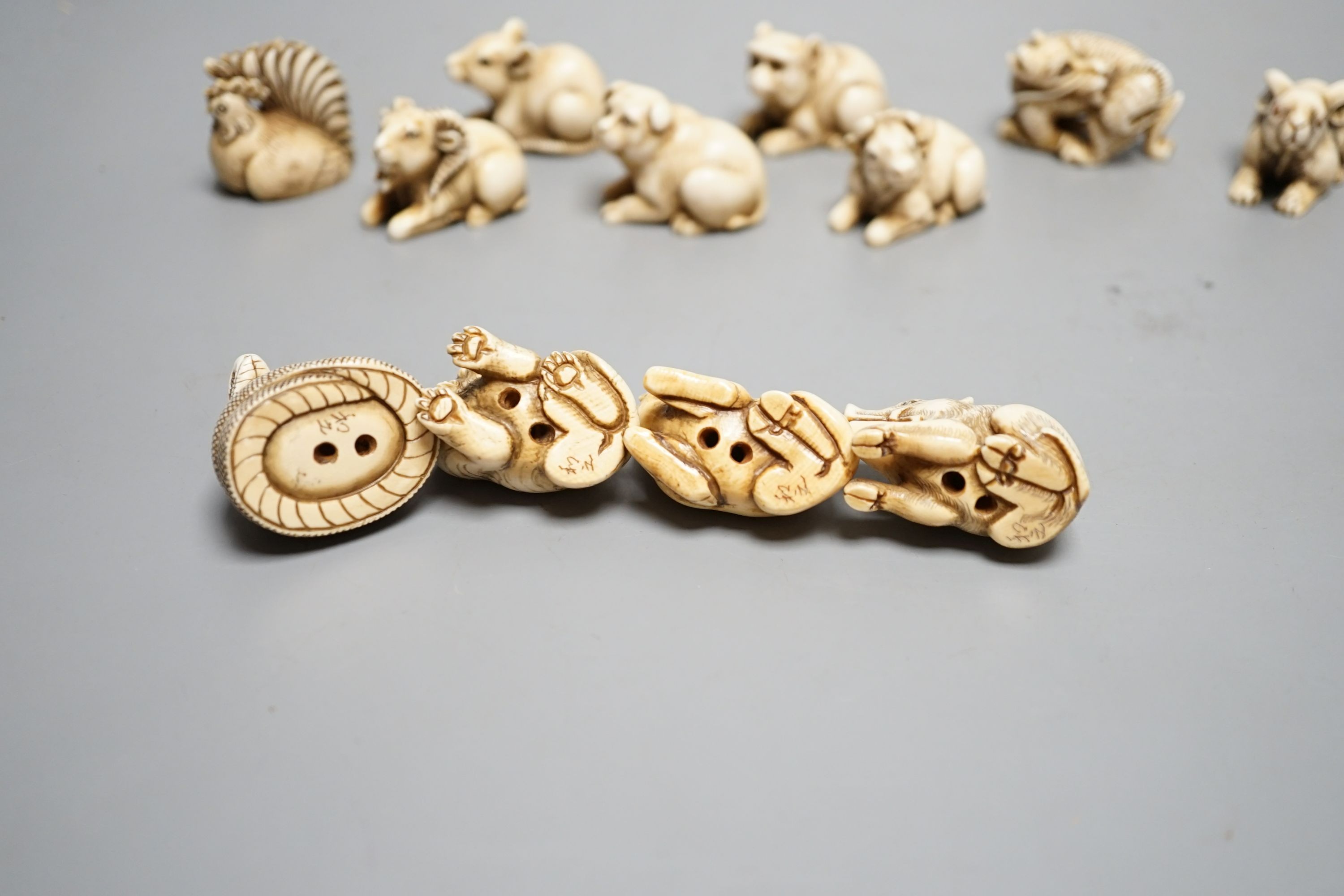 A set of 12 Japanese ivory zodiac animal netsuke, Taisho/early Showa period, signed